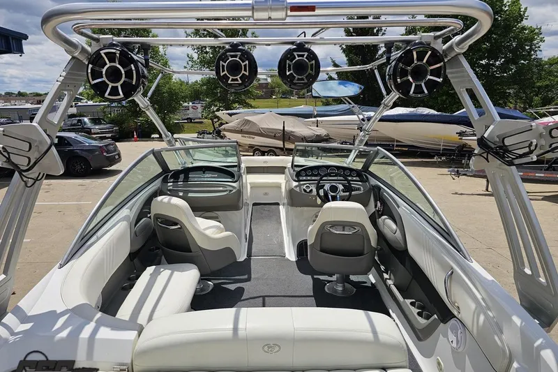 Slide: The Image of 2010 Cobalt 232 WSS boat interior with sleek seating and advanced audio system. - 45