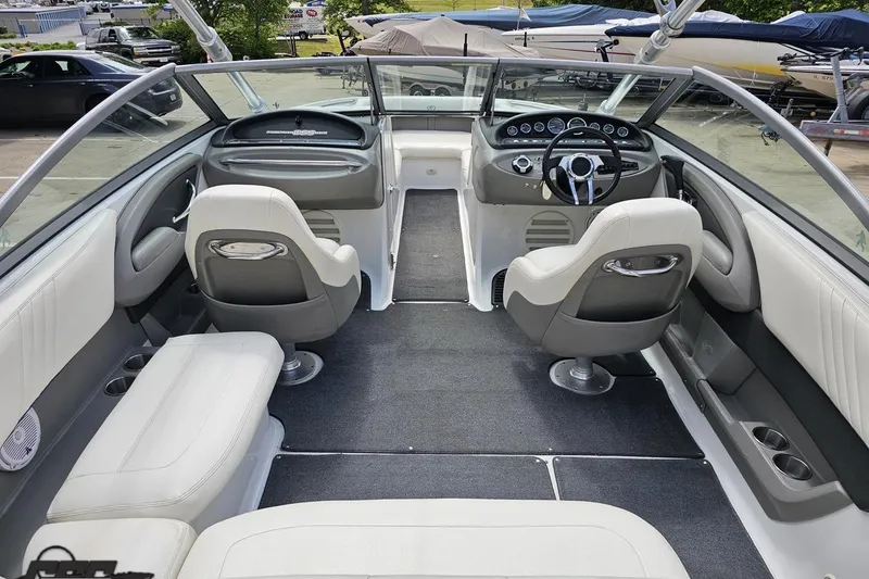 Slide: The Image of Interior of a 2010 Cobalt 232 WSS boat with sleek seating and modern dashboard. - 49