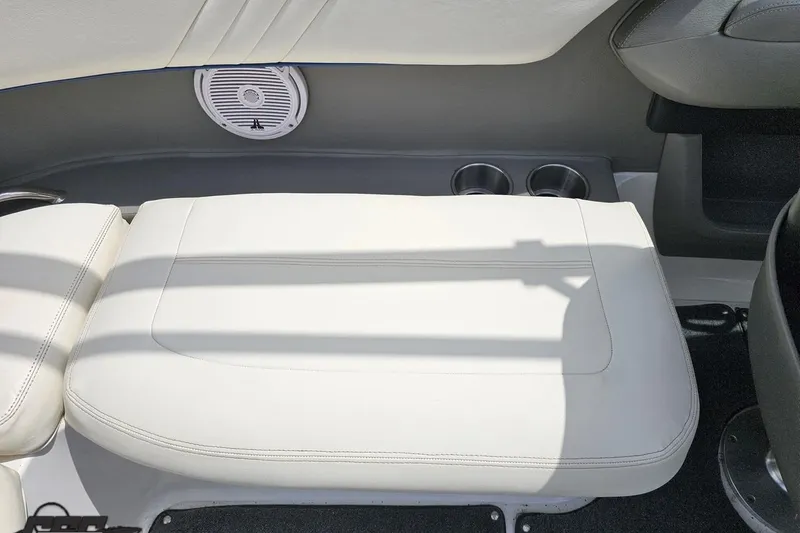 Slide: The Image of Interior of 2010 Cobalt 232 WSS boat with white seating and speaker. - 53