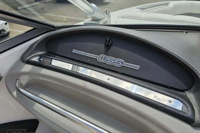 Slide: The Image of Dashboard of a 2010 Cobalt 232 WSS boat, featuring sleek design elements. - 58