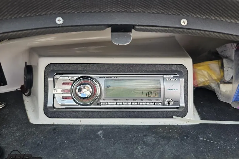 Slide: The Image of Sony marine stereo system in a 2010 Cobalt 232 WSS boat dashboard. - 59
