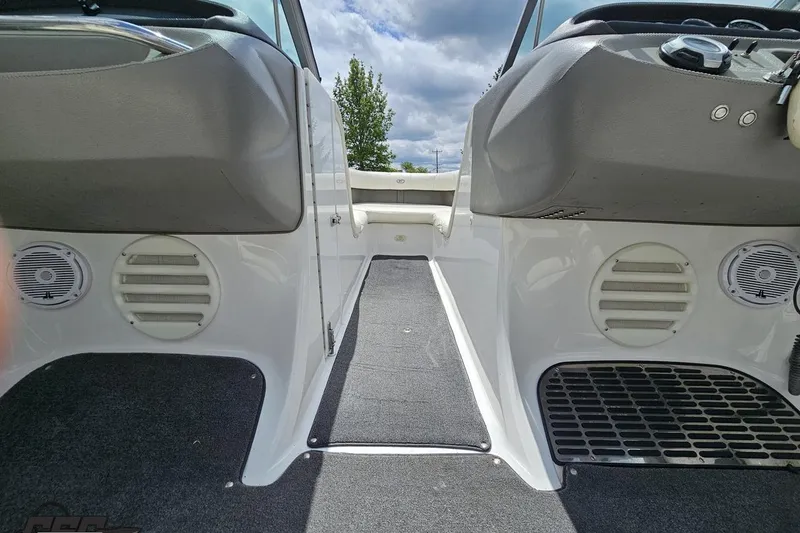 Slide: The Image of Interior view of a 2010 Cobalt 232 WSS boat, featuring seating and speakers. - 60