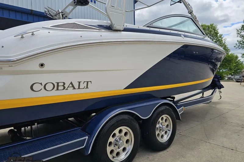 Slide: The Image of 2010 Cobalt 232 WSS boat on trailer, featuring sleek design and vibrant colors. - 8