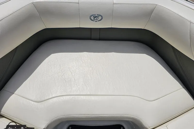 Slide: The Image of White leather seating on a 2010 Cobalt 232 WSS boat, featuring elegant stitching. - 82