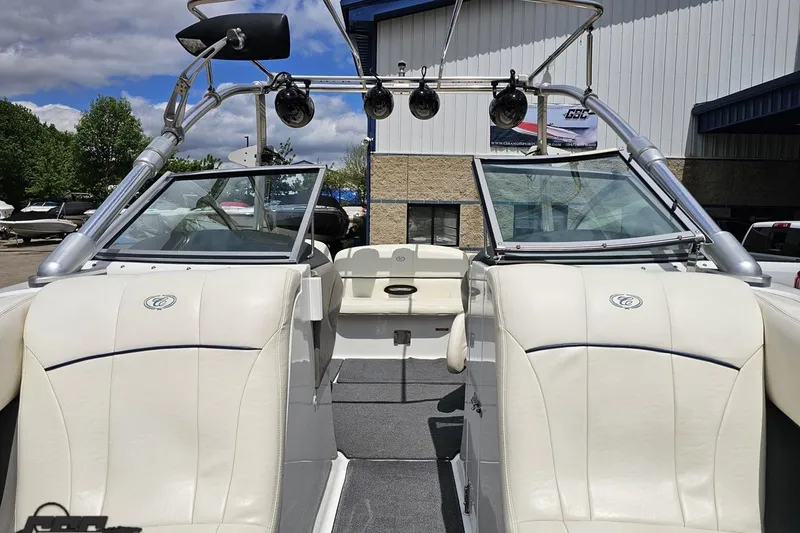 Slide: The Image of 2010 Cobalt 232 WSS boat interior with white seating and wakeboard tower. - 86