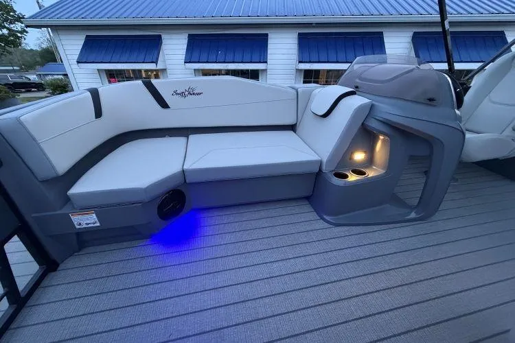 Slide: The Image of Luxurious seating on 2026 SunChaser Lucerne 22 LR DH Sport boat with ambient lighting. - 6
