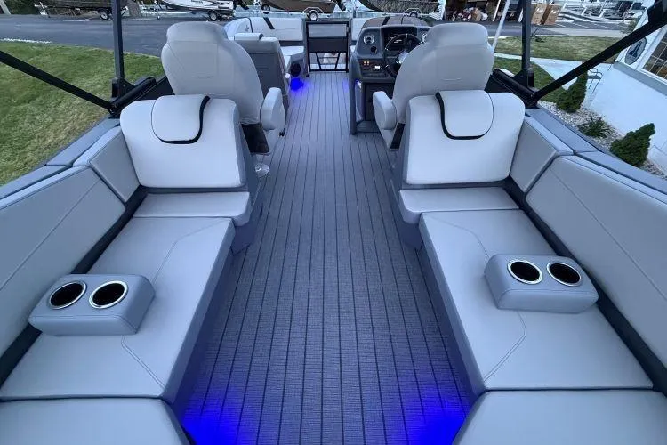 Slide: The Image of Luxurious interior of 2026 SunChaser Lucerne 22 LR DH Sport pontoon boat with ambient lighting. - 8