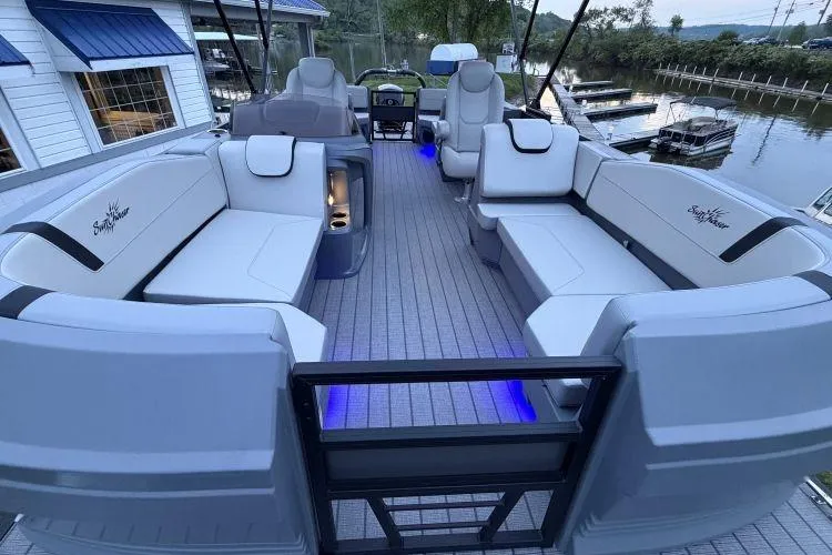 Slide: The Image of 2026 SunChaser Lucerne 22 LR DH Sport pontoon boat with luxurious seating and ambient lighting. - 9