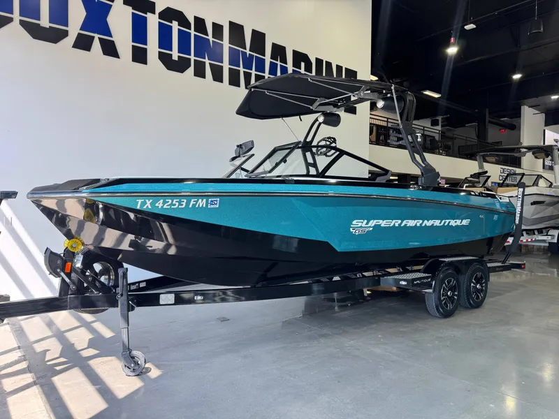 Slide: The Image of 2020 Nautique Super Air Nautique GS24 boat in showroom. - 2