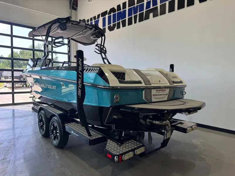 Slide: The Image of 2020 Nautique Super Air Nautique GS24 in a showroom. - 5