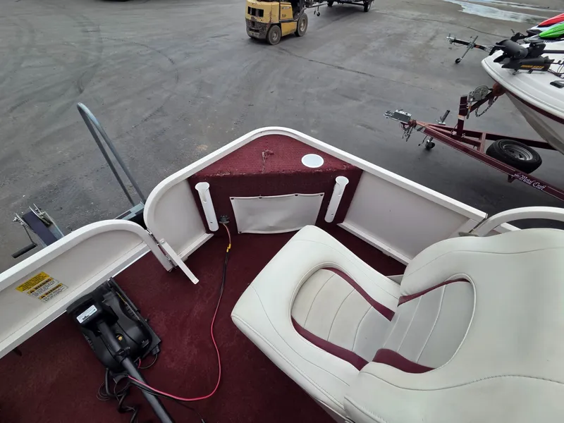 Slide: The Image of Interior of a 2005 Starcraft STR20 boat with seat and controls. - 11
