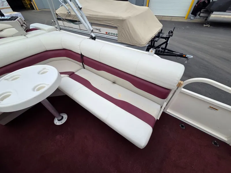 Slide: The Image of Interior of a 2005 Starcraft STR20 boat with seating and table. - 18