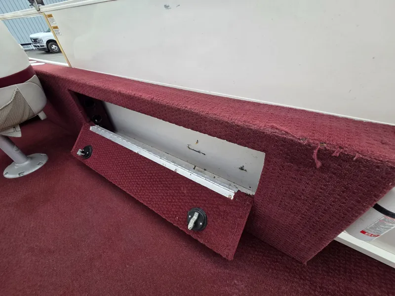 Slide: The Image of Interior of a 2005 Starcraft STR20 boat with red carpet. - 21