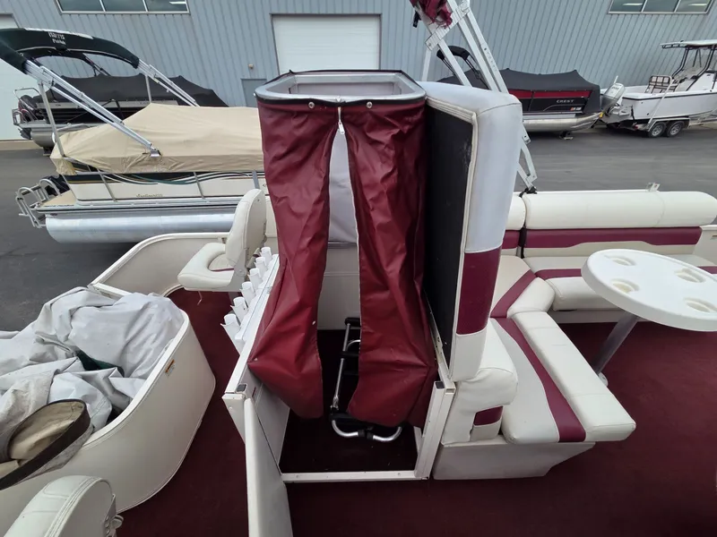 Slide: The Image of 2005 Starcraft STR20 pontoon boat with red canopy. - 23