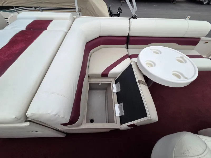 Slide: The Image of Interior of a 2005 Starcraft STR20 boat with seating and table. - 24