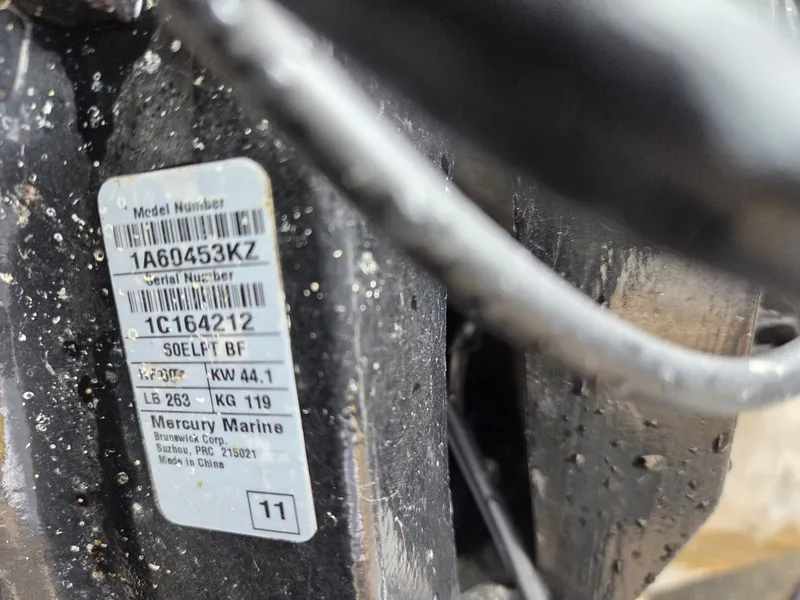 Slide: The Image of Close-up of a Mercury Marine engine label with serial number. - 31