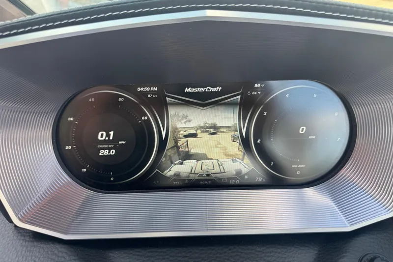 Slide: The Image of Dashboard display of a 2019 MasterCraft X24 boat showing speed and RPM gauges. - 12