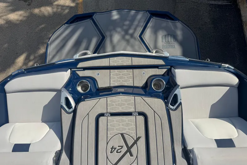 Slide: The Image of 2019 MasterCraft X24 boat interior with sleek seating and modern design elements. - 7
