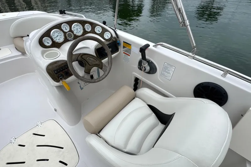 Slide: The Image of Cockpit of a 2017 Tahoe 195 boat with steering wheel and gauges. - 20