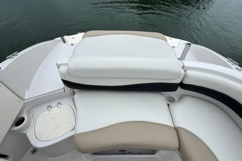 Slide: The Image of 2017 Tahoe 195 boat interior with cushioned seating and water view. - 21