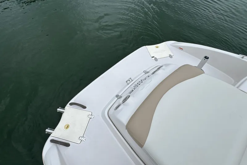 Slide: The Image of Rear view of a 2017 Tahoe 195 boat on water, showcasing seating and deck features. - 22