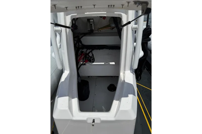 Slide: The Image of Interior view of 2026 Highfield Velox 560 boat, showcasing storage compartment and equipment. - 14