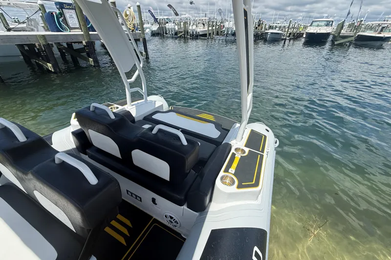 Slide: The Image of Highfield Velox 560 boat docked, showcasing sleek seating and modern design, 2026 model. - 6