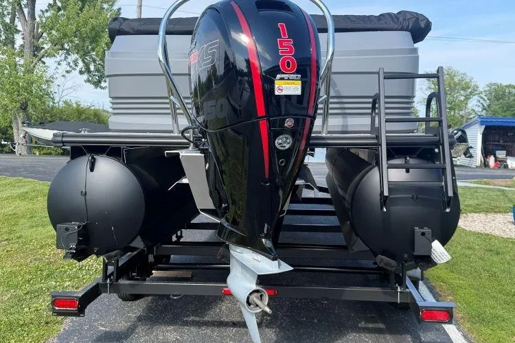 Slide: The Image of 2026 SunChaser Lucerne 22 LR DH Sport pontoon boat with powerful 150 HP outboard motor. - 2