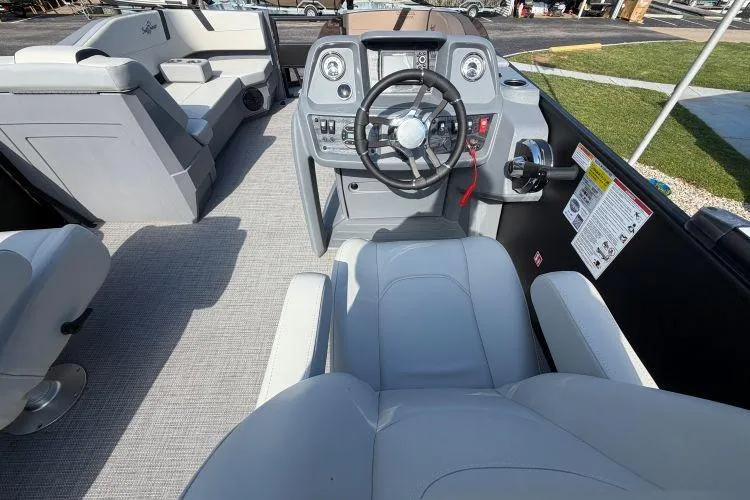 Slide: The Image of 2026 SunChaser Lucerne 22 LR DH Sport boat interior with modern helm and seating. - 5