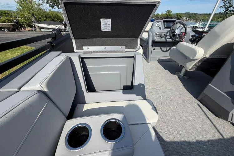 Slide: The Image of 2026 SunChaser Lucerne 22 LR DH Sport boat interior with seating and cup holders. - 7