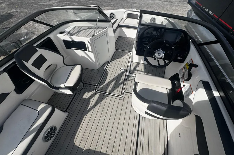 Slide: The Image of 2021 Yamaha Boats 195S interior with sleek seating and modern dashboard design. - 3