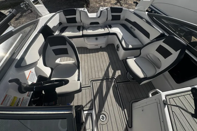 Slide: The Image of Interior of a 2021 Yamaha Boats 195S, featuring sleek seating and modern design. - 4