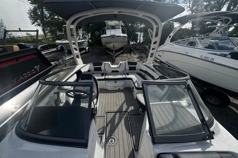 Slide: The Image of 2021 Yamaha Boats 195S interior view, showcasing sleek seating and modern design. - 5