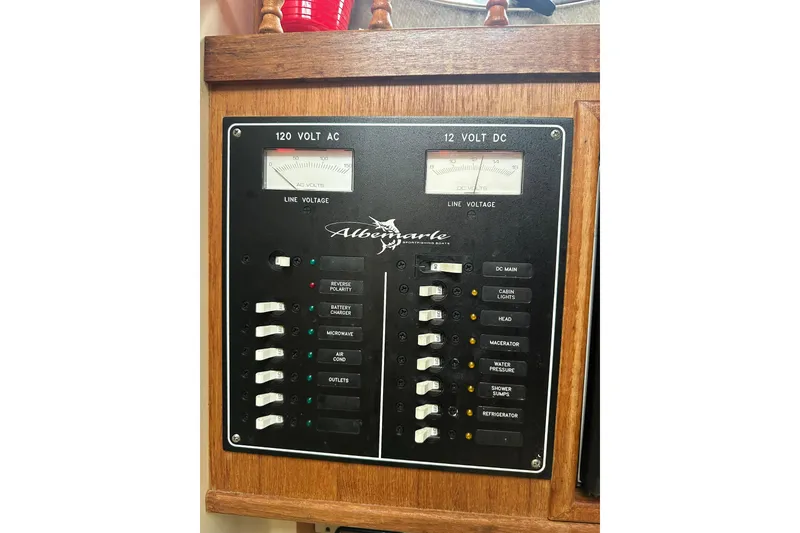 Slide: The Image of Electrical panel of a 2000 Albemarle 280 Express Fisherman boat, showing 120V AC and 12V DC systems. - 20