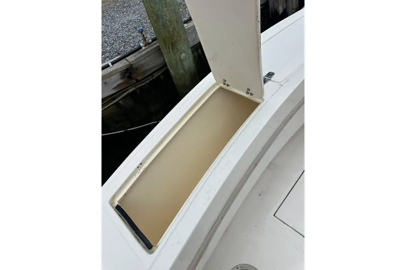 Slide: The Image of Open storage compartment on a 2000 Albemarle 280 Express Fisherman boat. - 27