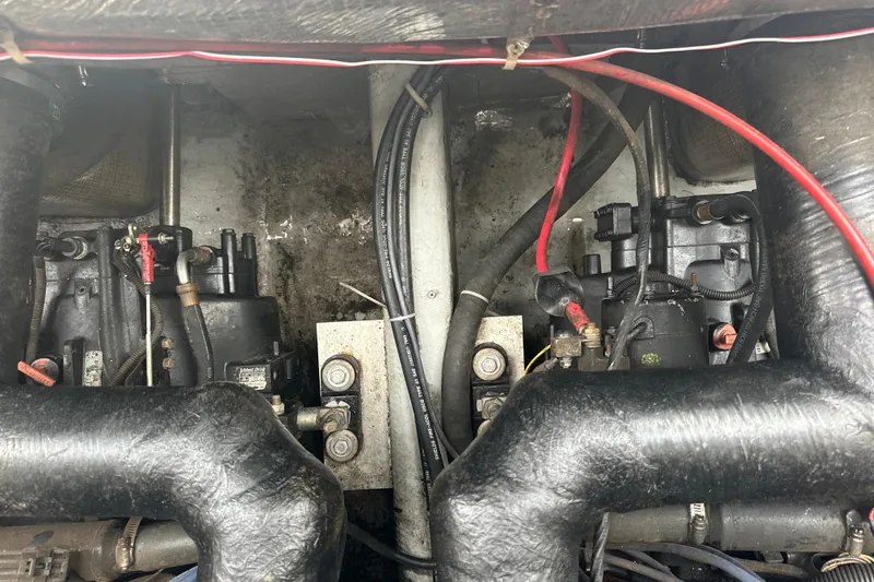 Slide: The Image of Engine compartment of a 2000 Albemarle 280 Express Fisherman boat, showing mechanical components. - 11