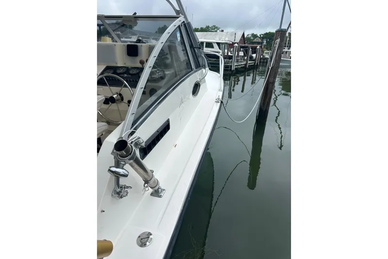 Slide: The Image of 2000 Albemarle 280 Express Fisherman docked, showcasing sleek design and fishing equipment. - 17