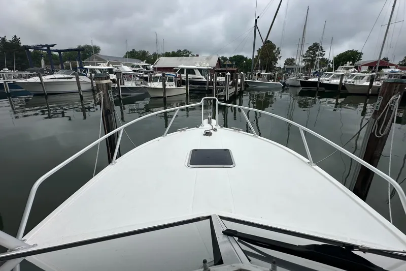 Slide: The Image of 2000 Albemarle 280 Express Fisherman docked in a marina with overcast skies. - 15