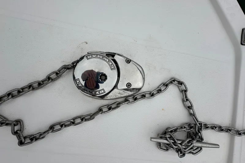 Slide: The Image of Anchor chain and windlass on 2000 Albemarle 280 Express Fisherman boat deck. - 25