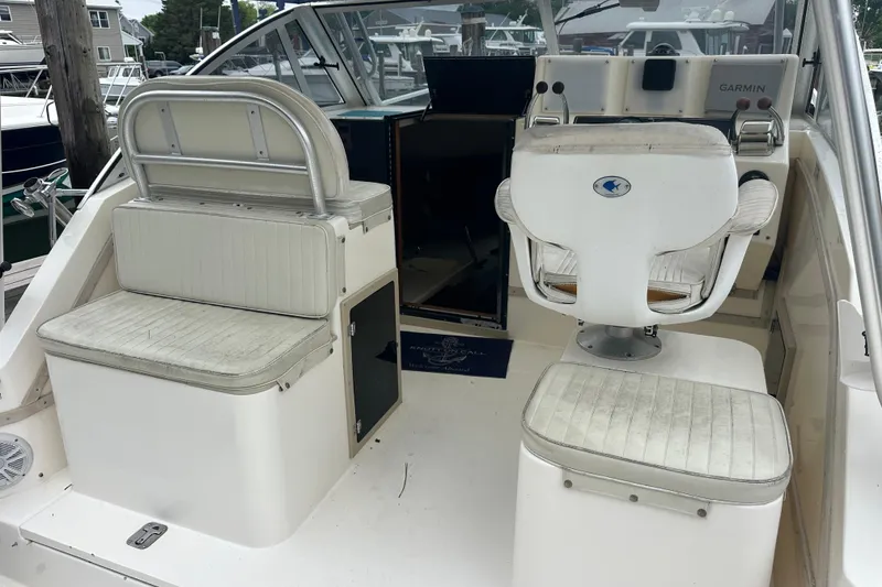 Slide: The Image of 2000 Albemarle 280 Express Fisherman boat interior with seating and control panel. - 26