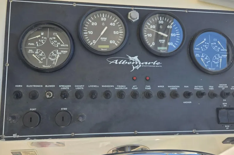 Slide: The Image of Instrument panel of a 2000 Albemarle 280 Express Fisherman boat with gauges and switches. - 5