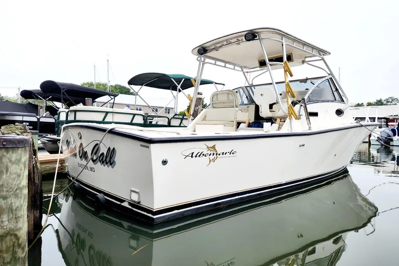 The Image of 2000 Albemarle 280 Express Fisherman boat docked in marina, featuring sleek design and fishing amenities. - 0