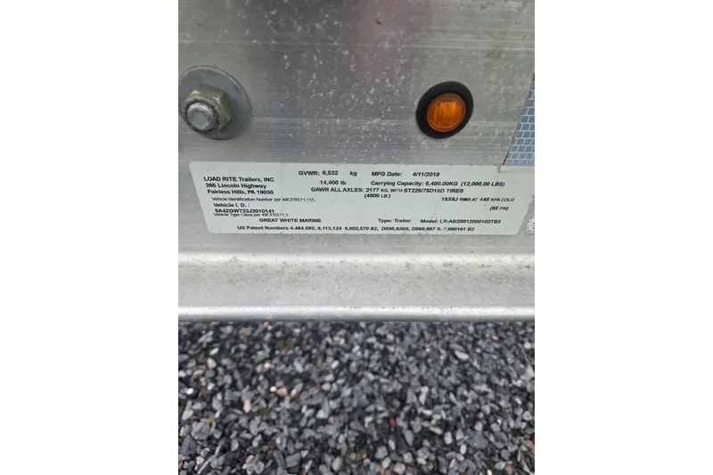 Slide: The Image of Label on Load Rite trailer, detailing specifications and manufacturing information. - 9