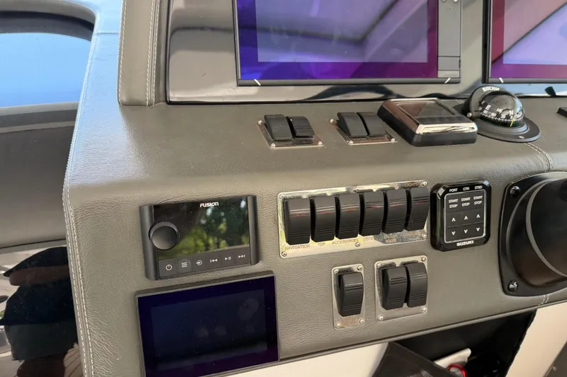 Slide: The Image of Control panel of a 2023 Schaefer 400 boat with navigation and audio systems. - 18