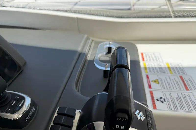 Slide: The Image of Control panel of a 2023 Schaefer 400 yacht, featuring throttle and joystick controls. - 22