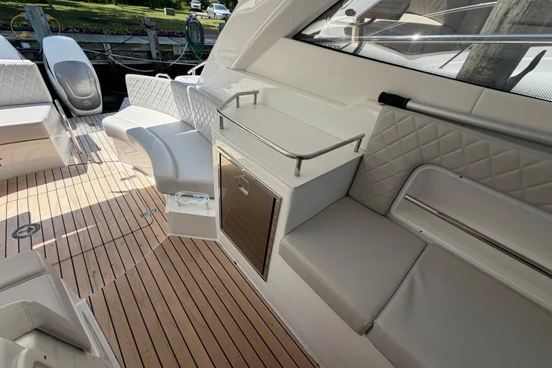 Slide: The Image of Luxurious 2023 Schaefer 400 yacht interior with elegant seating and teak flooring. - 27