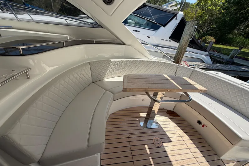 Slide: The Image of Luxurious seating area on 2023 Schaefer 400 yacht with elegant wood table and plush upholstery. - 28