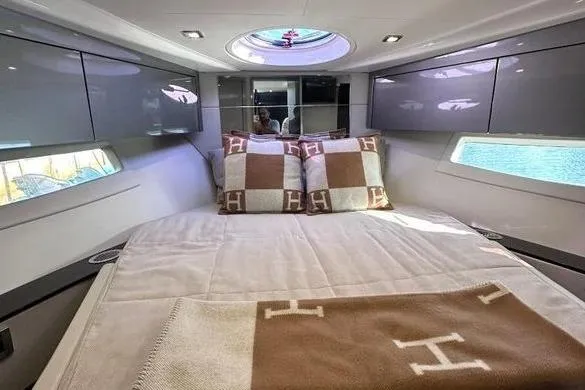Slide: The Image of Luxurious cabin interior of 2023 Schaefer 400 yacht with elegant bedding and modern design. - 3