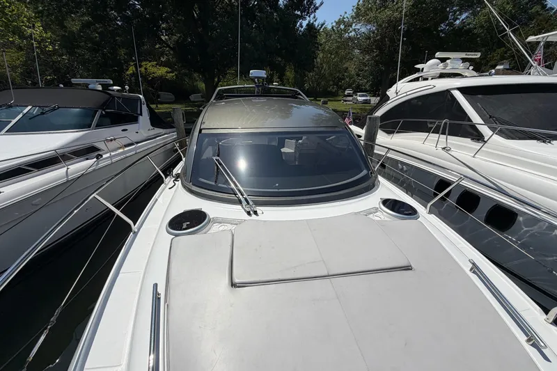 Slide: The Image of 2023 Schaefer 400 yacht docked between two other boats, showcasing sleek design. - 35