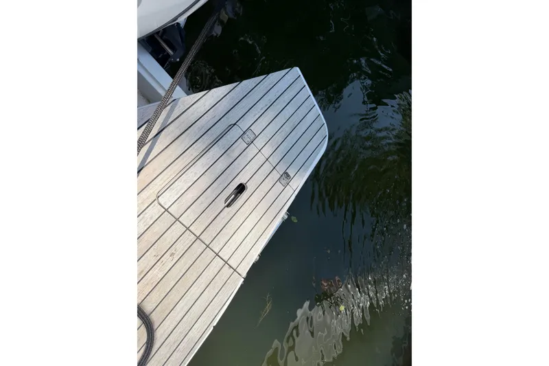 Slide: The Image of Schaefer 400 yacht's wooden deck over water, 2023 model. - 36